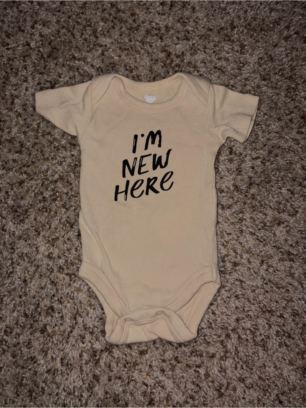 Cream Baby Bodysuit with "I'm New Here" Text